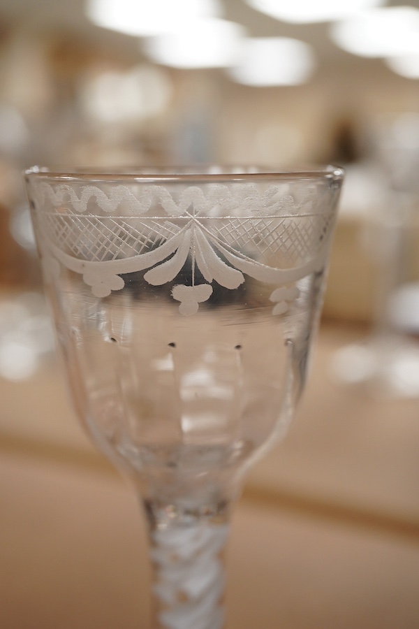 Two 18th century DSOT cordial glasses, one bowl engraved with roses, the other with swag decoration, tallest 16.5cm